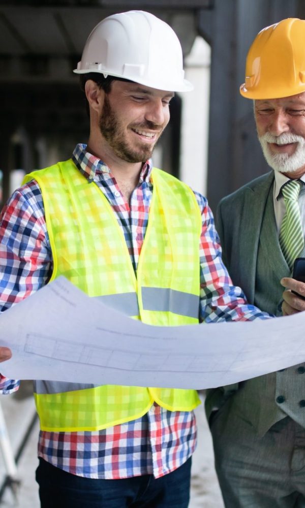 engineer-foreman-and-worker-discussing-in-building-construction-site-3-e1600417370299.jpg